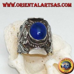 Silver ring with oval cabochon lapis lazuli and Nepalese setting with flower on the sides