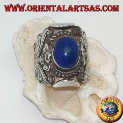 Silver ring with oval cabochon lapis lazuli and Nepalese setting with flower on the sides