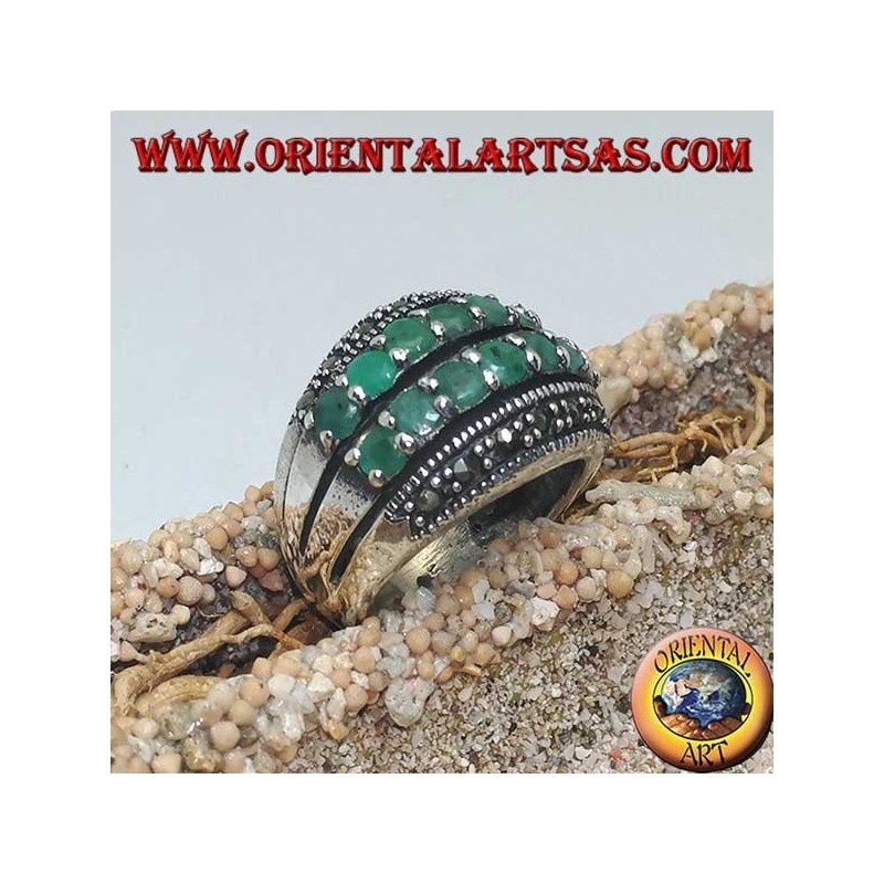 Silver ring with a rounded band with two rows of emeralds set between two rows of marcasites