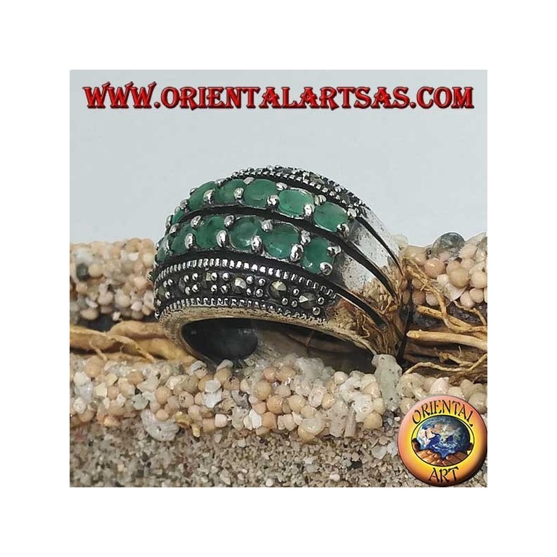 Silver ring with a rounded band with two rows of emeralds set between two rows of marcasites