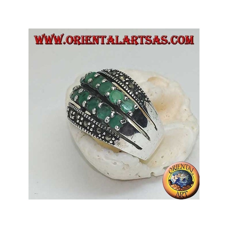 Silver ring with a rounded band with two rows of emeralds set between two rows of marcasites