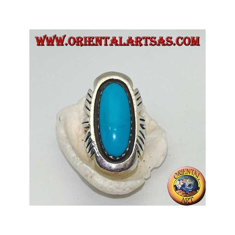 Silver ring with elongated oval turquoise on a smooth frame ruled on the sides