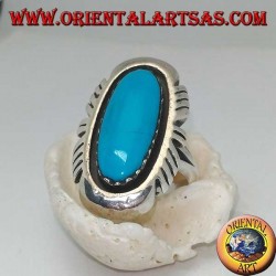 Silver ring with elongated oval turquoise on a smooth frame ruled on the sides