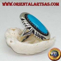 Silver ring with elongated oval turquoise on a smooth frame ruled on the sides