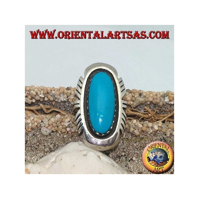 Silver ring with elongated oval turquoise on a smooth frame ruled on the sides