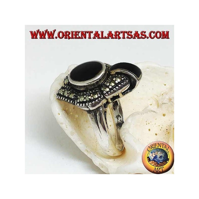 Silver ring with oval onyx surrounded by marcasites and an onyx band