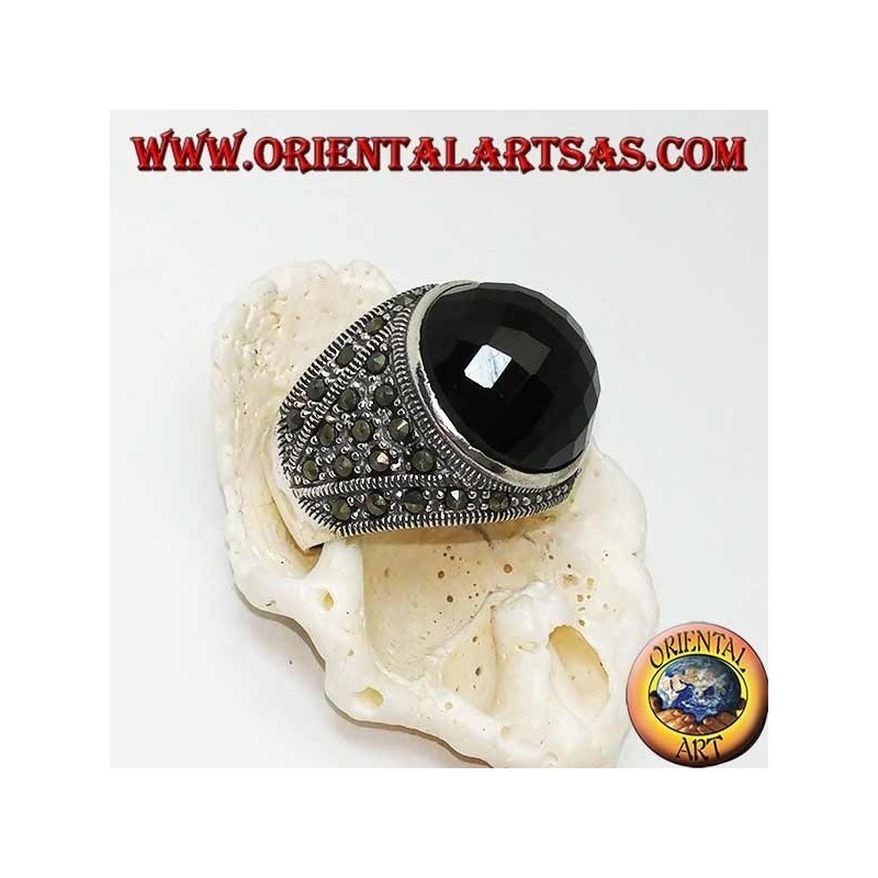 Silver ring with round faceted cabochon onyx surrounded by marcasites on the sides