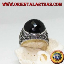 Silver ring with round faceted cabochon onyx surrounded by marcasites on the sides