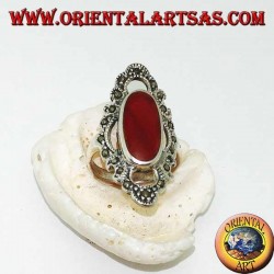 Silver ring with elongated oval carnelian surrounded by a wavy line of marcasite