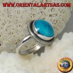 Silver ring with a round cabochon turquoise surrounded by a row of disks (14)