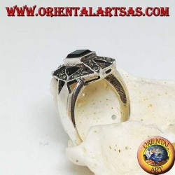 Silver ring with rectangular onyx overlapping X and hexagon with marcasite
