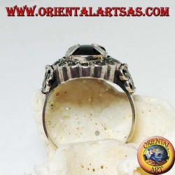 Silver ring with oval cabochon onyx set and surrounded by marcasite balls