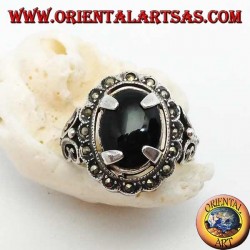 Silver ring with oval cabochon onyx set and surrounded by marcasite balls