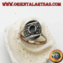 Oval silver ring with central onyx on an oblique band of marcasite between two of onyx