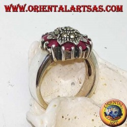 Silver flower ring studded with marcasites surrounded by natural rubies set