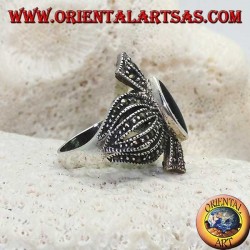 Silver ring with shuttle onyx on a rounded cross frame studded with marcasite