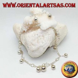 Silver anklet with hanging bells and alternating discs