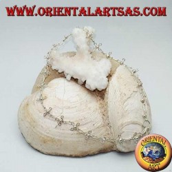 Silver anklet with stylized four-leaf clovers and a bell