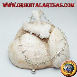 Silver anklet with stylized four-leaf clovers and a bell