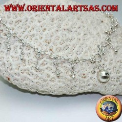 Silver anklet with hanging balls and a bell