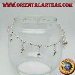 Silver anklet with hanging dolphins and a bell