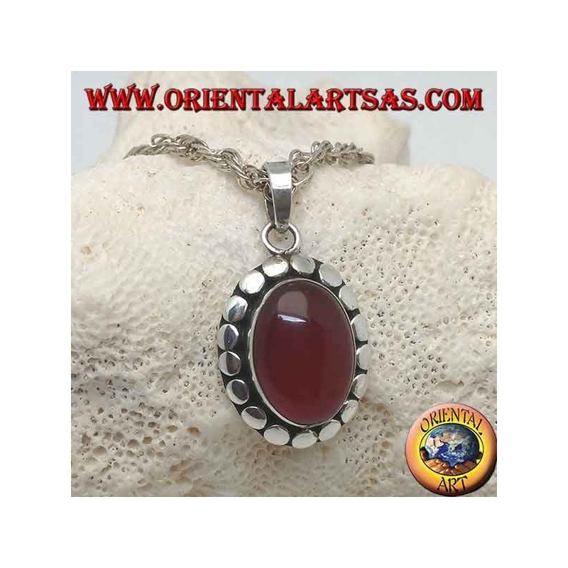 Silver pendant with oval cabochon carnelian surrounded by diskette studs