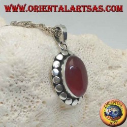 Silver pendant with oval cabochon carnelian surrounded by diskette studs
