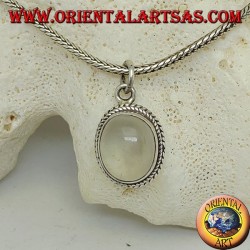 Silver pendant with oval moonstone surrounded by subtle weaves