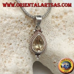 Colgante de plata con topacio amarillo natural rodeado de entrelazados y bolas.