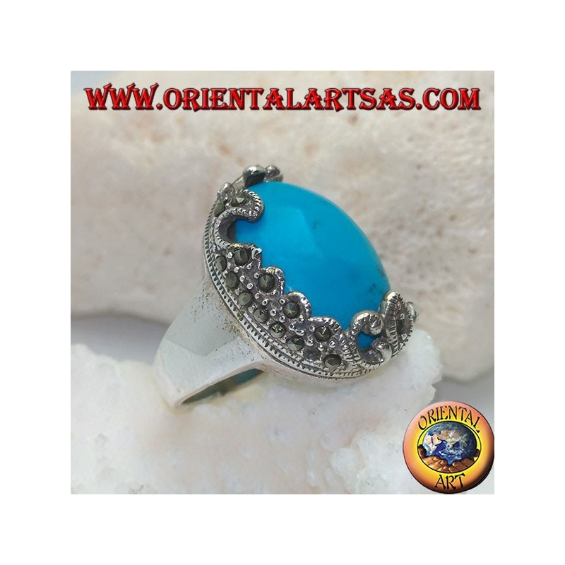 Silver ring with oval cabochon turquoise and decorations with floral marcasites on one side only