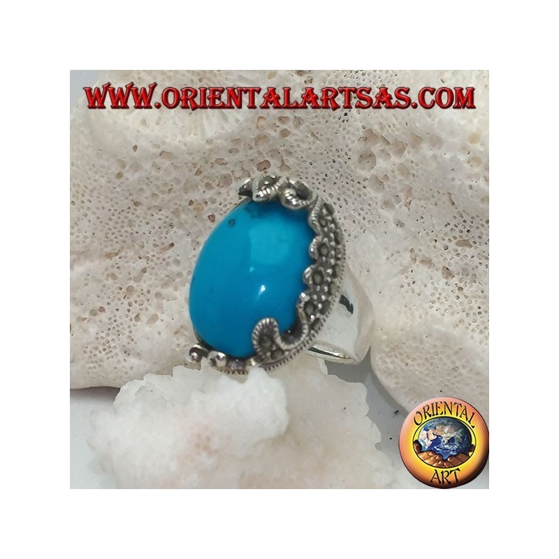 Silver ring with oval cabochon turquoise and decorations with floral marcasites on one side only