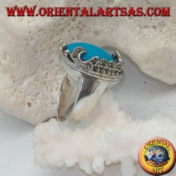 Silver ring with oval cabochon turquoise and decorations with floral marcasites on one side only