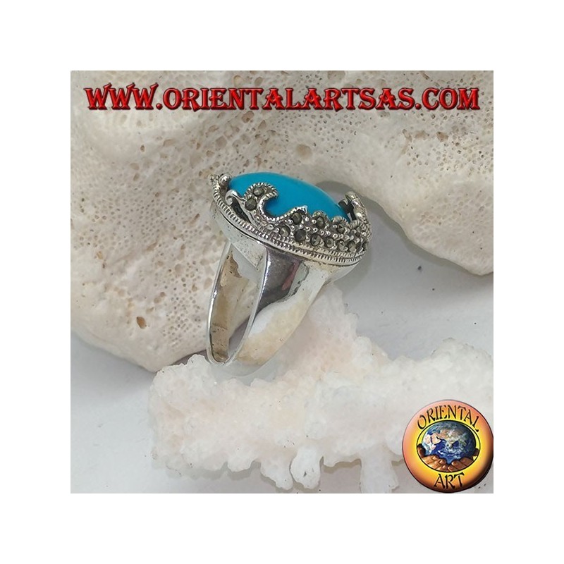Silver ring with oval cabochon turquoise and decorations with floral marcasites on one side only