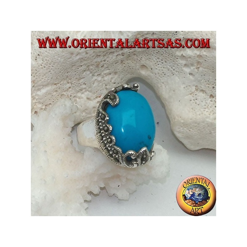 Silver ring with oval cabochon turquoise and decorations with floral marcasites on one side only