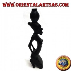 Sculpture of a water pumping woman (water carrier) kneeling in ebony wood