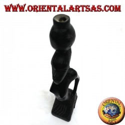 Sculpture of a water pumping woman (water carrier) kneeling in ebony wood