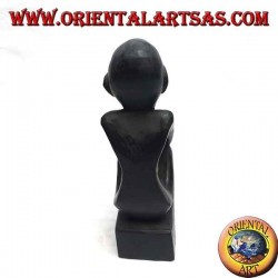 Sculpture of a seated thinker with bent legs in ebony wood