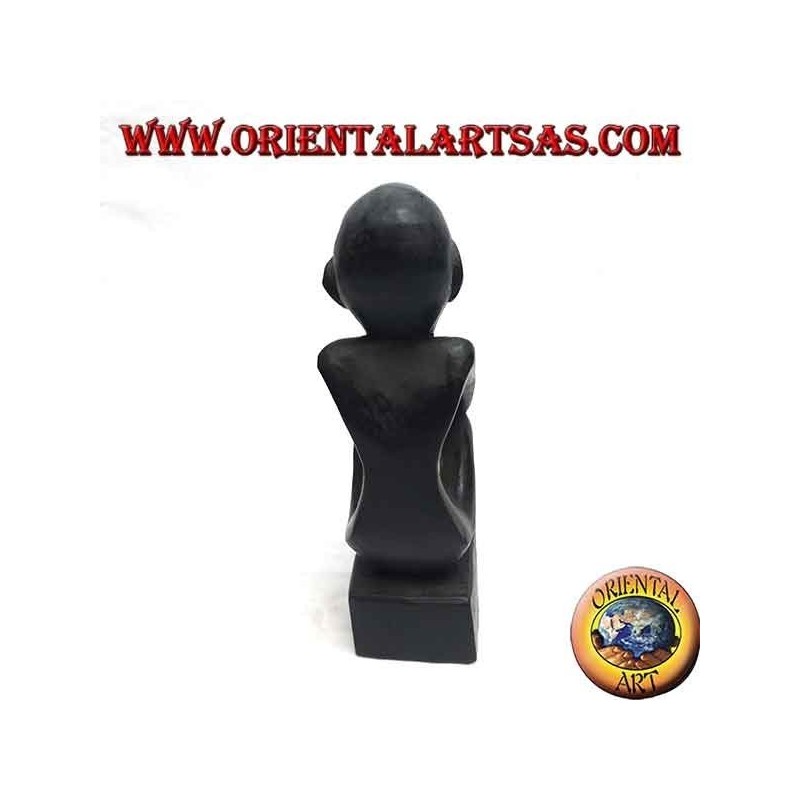 Sculpture of a seated thinker with bent legs in ebony wood