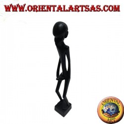 Sculpture of a man who masturbates standing in ebony wood