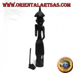 Sculpture of a farmer holding a hoe on the shoulder and a pointed ebony hat