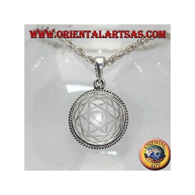 Silver pendant with Sri Yantra engraved in the round rock crystal and intertwined edge