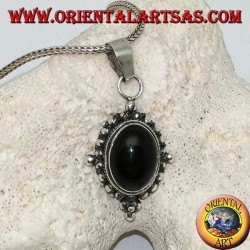 Silver pendant with oval onyx cabochon surrounded by subtle weave, dots and the four cardinal points