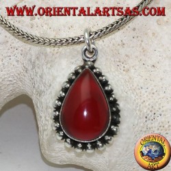 Silver pendant with teardrop cabochon carnelian surrounded by a row of small and large balls