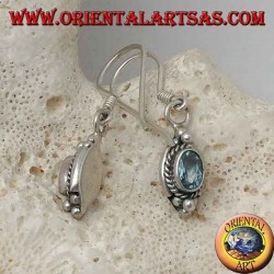 Silver earrings with natural oval blue topaz surrounded by intertwining and three balls above and below