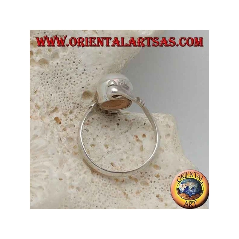 Silver ring with natural pearl in the center between helical arms