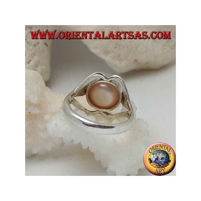 Silver ring with natural pearl in the center between lip lines