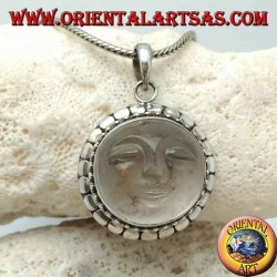 Silver pendant with sun hollowed out on a round rock crystal and diskette contour
