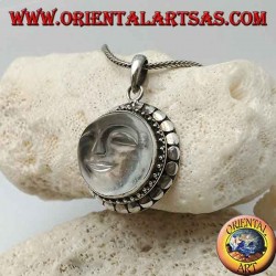 Silver pendant with sun hollowed out on a round rock crystal and diskette contour