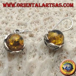 Silver earrings with natural amber sphere between the leaves