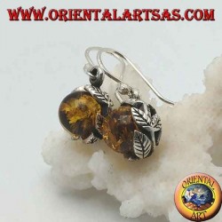 Silver earrings with natural amber sphere between the leaves